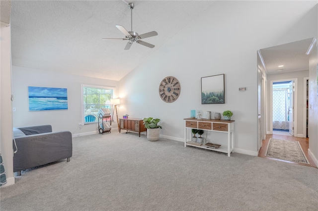3968 Orchard Hill Cir, Palm Harbor, FL 34684 - living room featuring high vaulted ceiling, carpet flooring, a ceiling fan, and baseboards