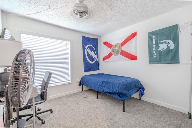 3968 Orchard Hill Cir, Palm Harbor, FL 34684 - carpeted bedroom with baseboards, an office area, and a textured ceiling
