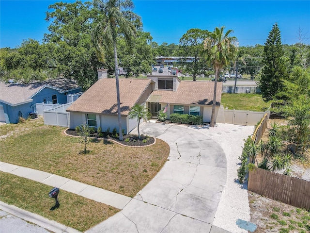 3968 Orchard Hill Cir, Palm Harbor, FL 34684 - view of front of home featuring curved driveway, a gate, and stucco siding