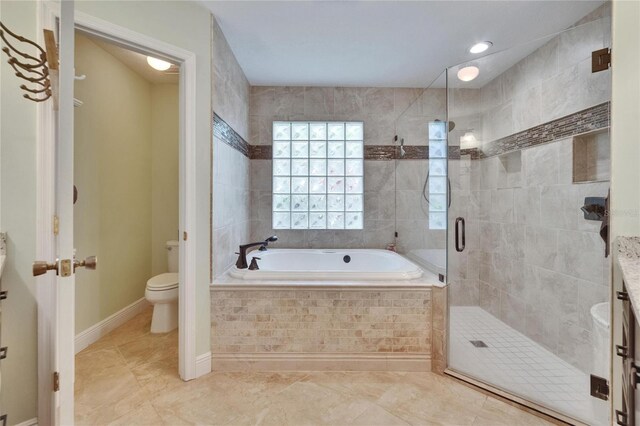 905 Balsamina Dr, Brandon, FL 33510 - bathroom featuring a garden tub, a shower stall, toilet, and tile patterned flooring