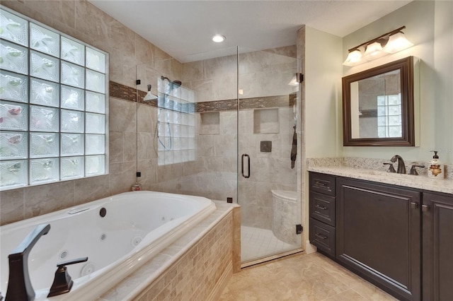 905 Balsamina Dr, Brandon, FL 33510 - bathroom with a jetted tub, a stall shower, vanity, and tile patterned floors