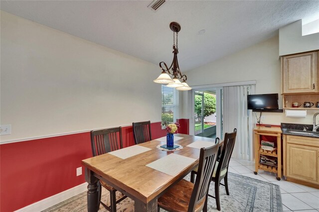 905 Balsamina Dr, Brandon, FL 33510 - dining space featuring vaulted ceiling and light tile patterned flooring