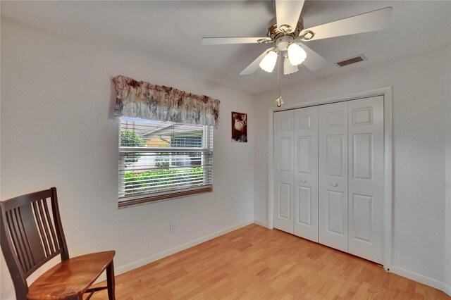 905 Balsamina Dr, Brandon, FL 33510 - unfurnished bedroom with light wood-style flooring, baseboards, a closet, and a ceiling fan