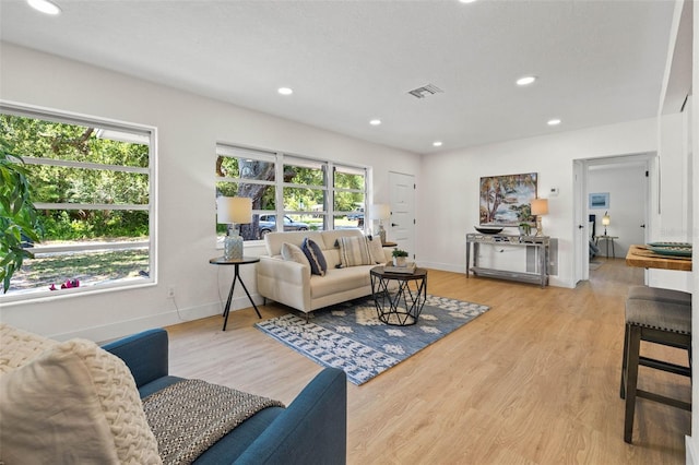 3300 52nd St N, Saint Petersburg, FL 33710 - living room featuring light wood-style floors, baseboards, and recessed lighting