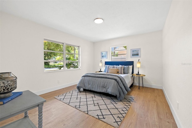 3300 52nd St N, Saint Petersburg, FL 33710 - bedroom with multiple windows, baseboards, and wood finished floors