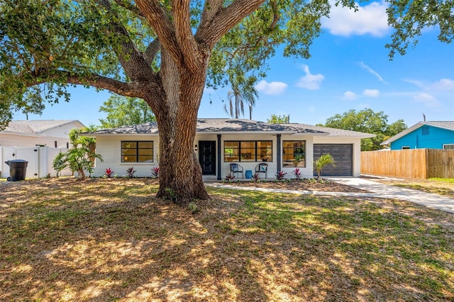 3300 52nd St N, Saint Petersburg, FL 33710 - view of front of home with a garage and concrete driveway