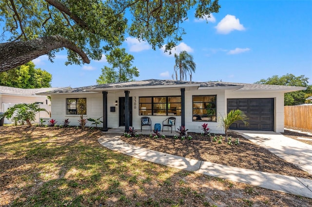 3300 52nd St N, Saint Petersburg, FL 33710 - single story home with covered porch, a garage, and driveway