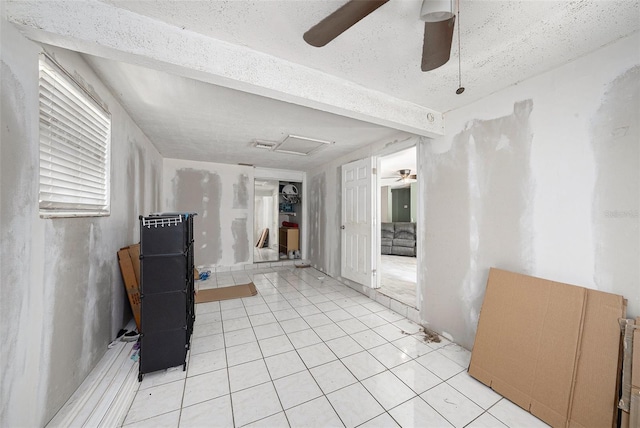 11486 92nd St N, Largo, FL 33773 - empty room with a ceiling fan and light tile patterned floors