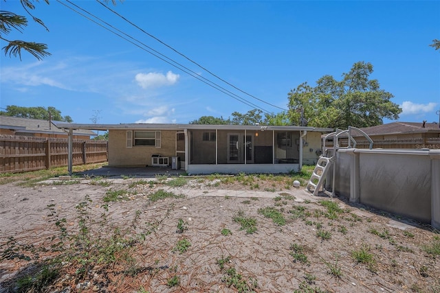 11486 92nd St N, Largo, FL 33773 - back of house with a sunroom