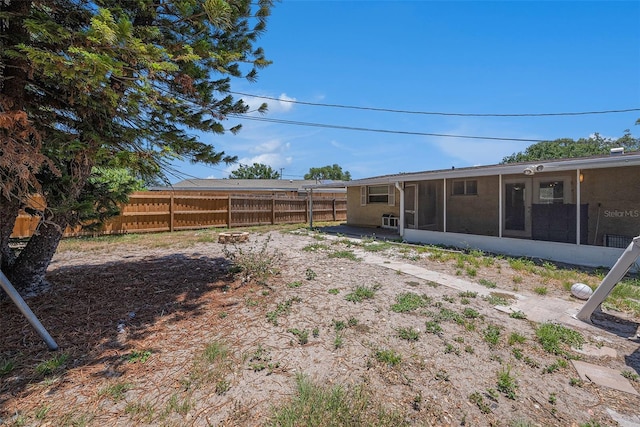 11486 92nd St N, Largo, FL 33773 - fenced backyard with a sunroom