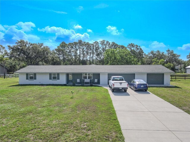 12220 Twin Branch Acres Rd, Tampa, FL 33626 - ranch-style house featuring driveway, a garage, and a porch