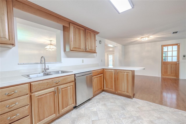 12220 Twin Branch Acres Rd, Tampa, FL 33626 - kitchen with stainless steel dishwasher, a sink, light countertops, a peninsula, and a chandelier