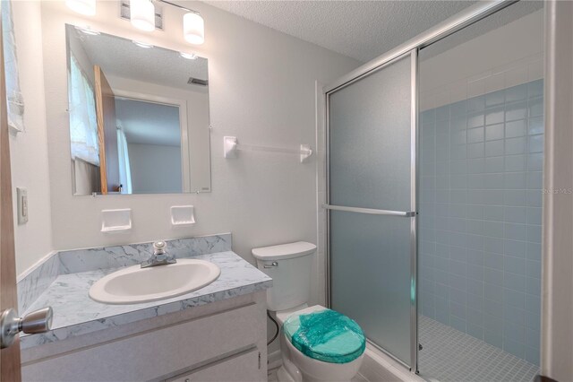 12220 Twin Branch Acres Rd, Tampa, FL 33626 - bathroom featuring toilet, vanity, a stall shower, and a textured ceiling