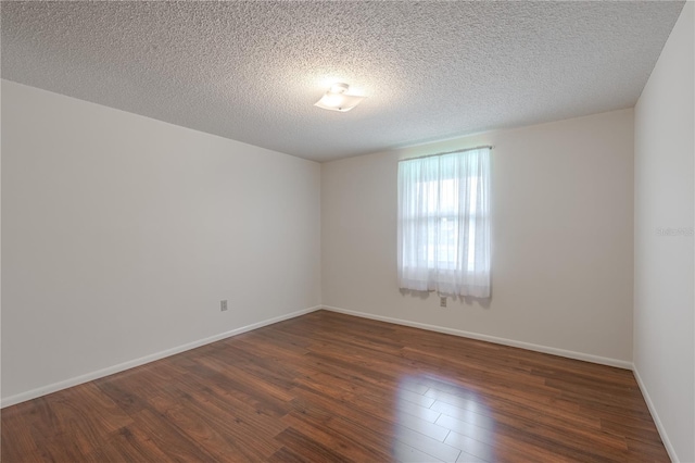 12220 Twin Branch Acres Rd, Tampa, FL 33626 - unfurnished room with dark wood-style floors, baseboards, and a textured ceiling