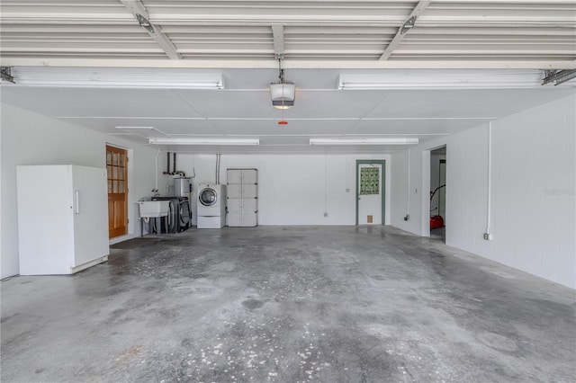 12220 Twin Branch Acres Rd, Tampa, FL 33626 - garage featuring washer / clothes dryer, a garage door opener, a sink, and water heater