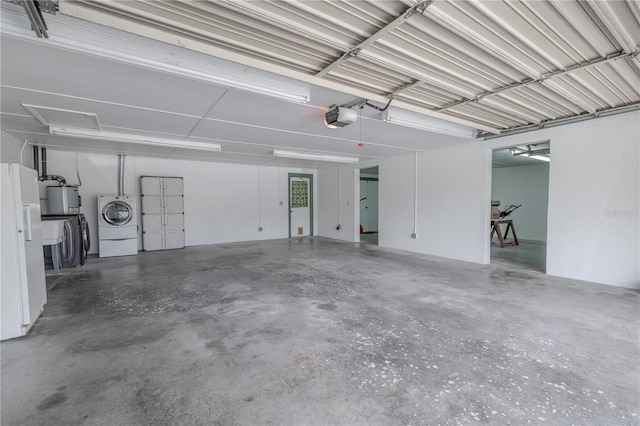 12220 Twin Branch Acres Rd, Tampa, FL 33626 - garage featuring a garage door opener, washer / dryer, and gas water heater