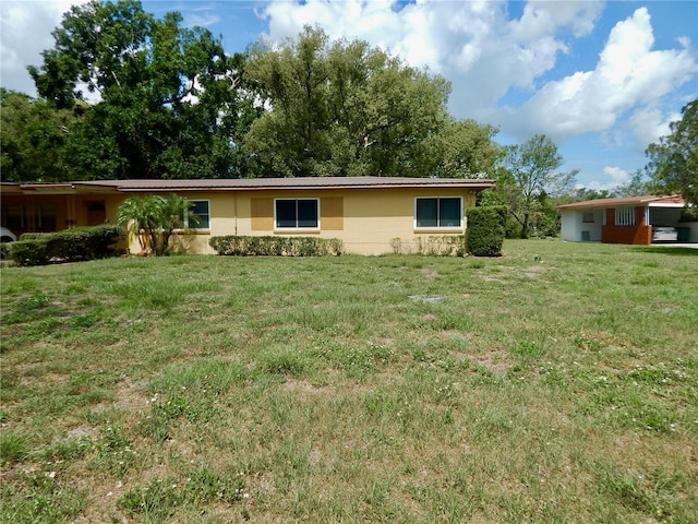 10308 Fore Dr, Tampa, FL 33612 - ranch-style home with a front lawn and stucco siding