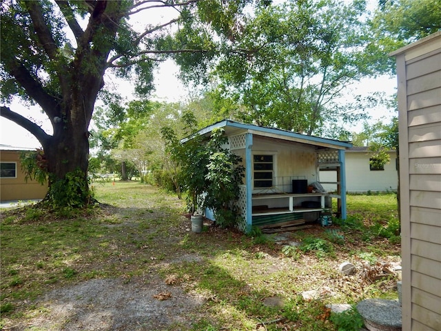 10308 Fore Dr, Tampa, FL 33612 - view of yard featuring an outdoor structure
