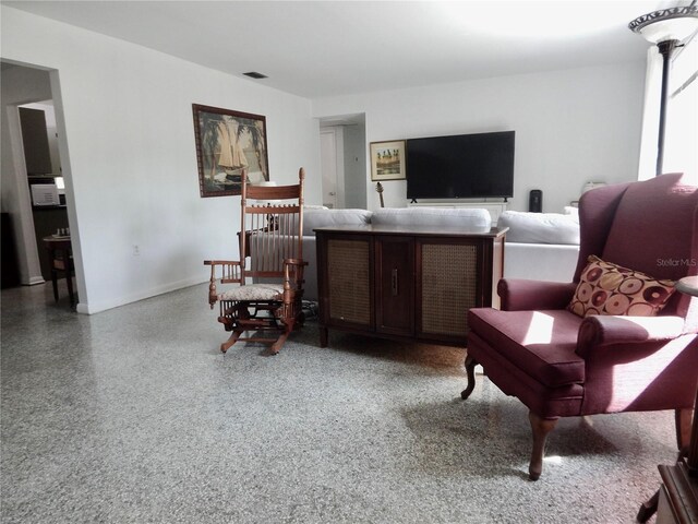 10308 Fore Dr, Tampa, FL 33612 - living room featuring baseboards