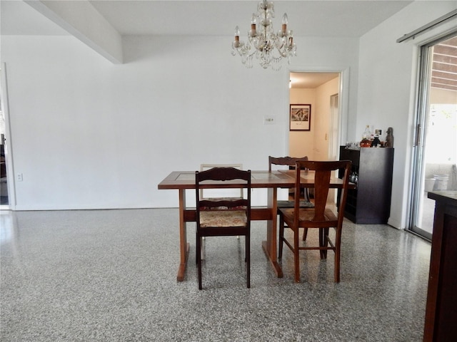 10308 Fore Dr, Tampa, FL 33612 - dining space featuring a chandelier and speckled floor