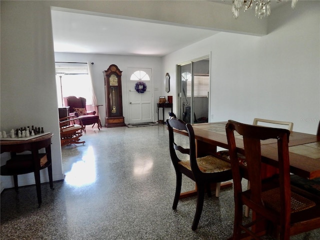 10308 Fore Dr, Tampa, FL 33612 - dining space with a chandelier and speckled floor