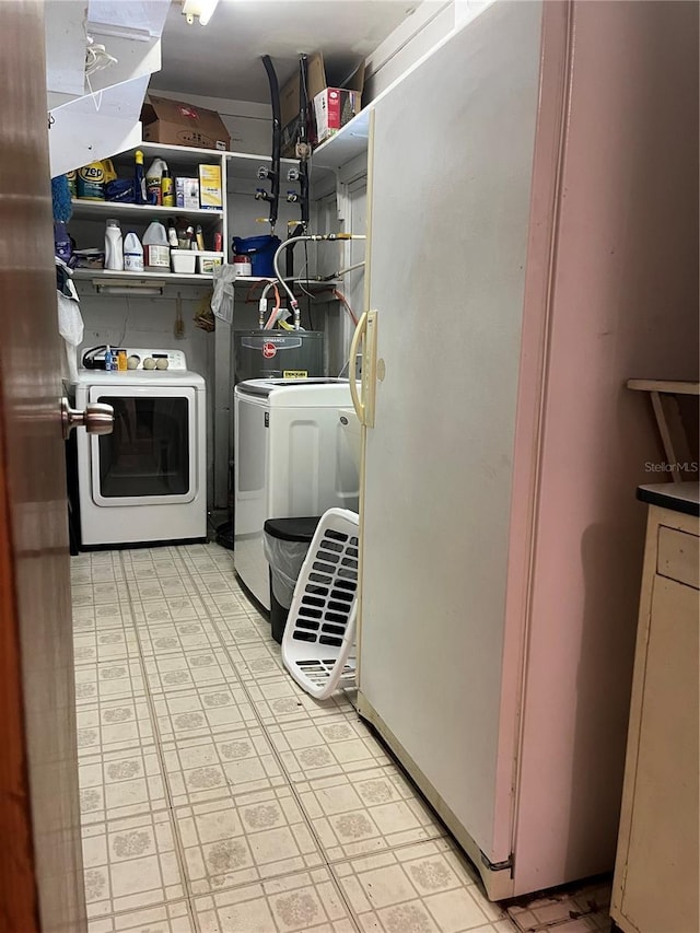 10308 Fore Dr, Tampa, FL 33612 - washroom featuring separate washer and dryer and light flooring