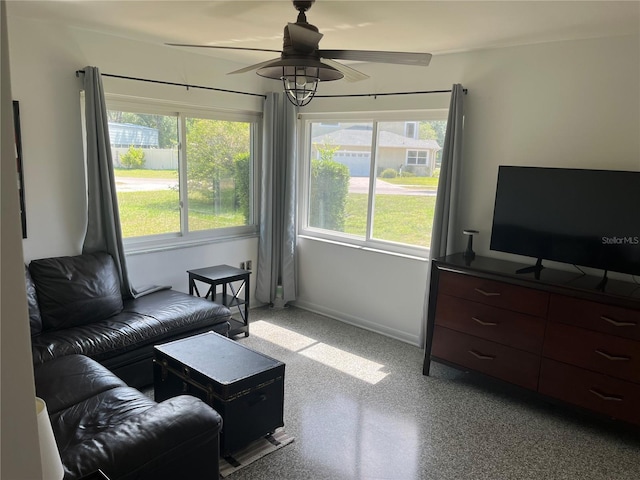10308 Fore Dr, Tampa, FL 33612 - living area featuring ceiling fan, healthy amount of natural light, and baseboards