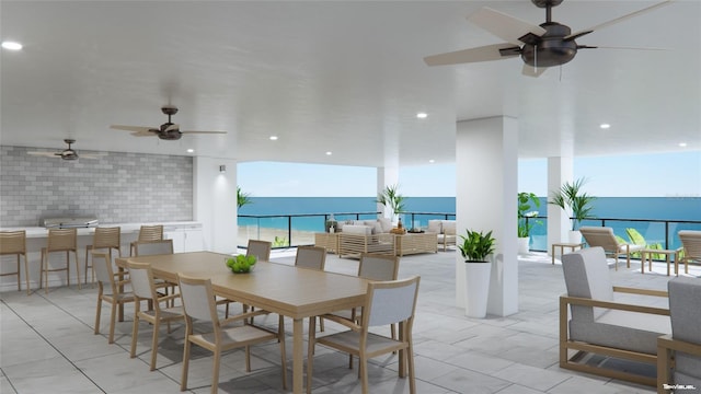 14048 Gulf Blvd Unit 201, Madeira Beach, FL 33708 - dining room with ceiling fan, recessed lighting, a water view, and light tile patterned floors