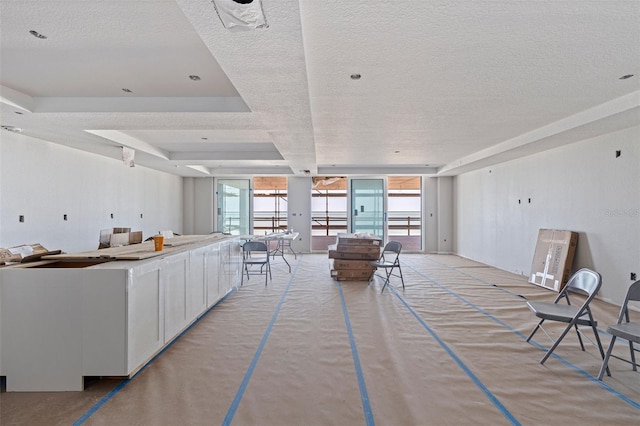 14048 Gulf Blvd Unit 201, Madeira Beach, FL 33708 - living area featuring a textured ceiling and healthy amount of natural light