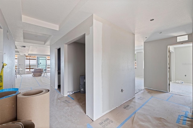 14048 Gulf Blvd Unit 201, Madeira Beach, FL 33708 - hallway featuring a textured ceiling