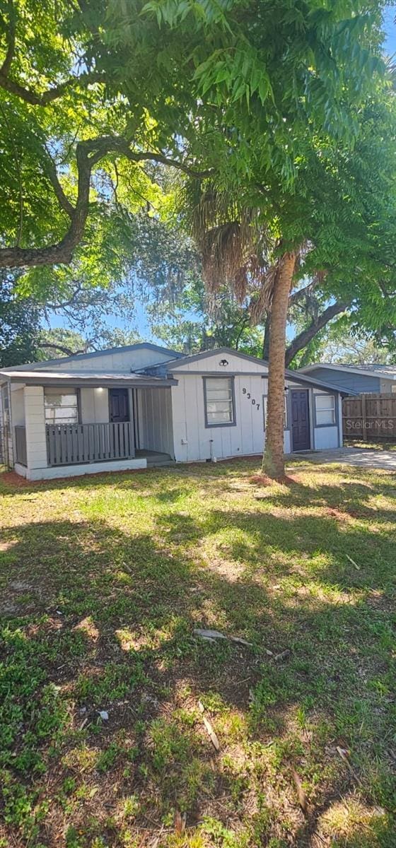 9307 N 16th St, Tampa, FL 33612 - view of front of home featuring a garage