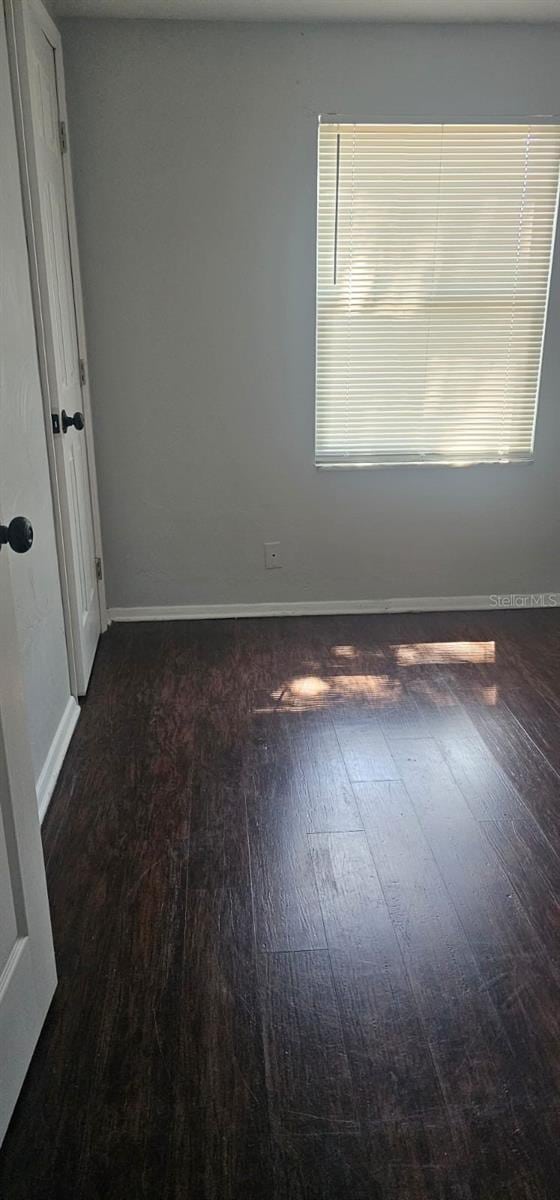9307 N 16th St, Tampa, FL 33612 - unfurnished room with wood-type flooring and baseboards