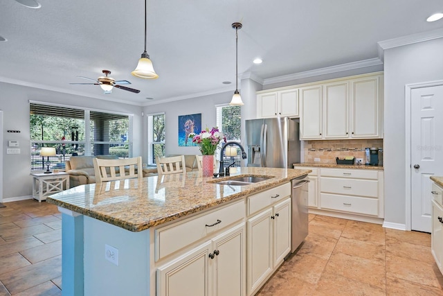 5401 Match Point Pl, Lithia, FL 33547 - kitchen featuring appliances with stainless steel finishes, a sink, ornamental molding, decorative backsplash, and a ceiling fan