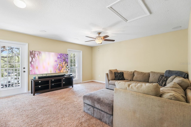 5401 Match Point Pl, Lithia, FL 33547 - living room featuring attic access, carpet, baseboards, a textured ceiling, and a ceiling fan