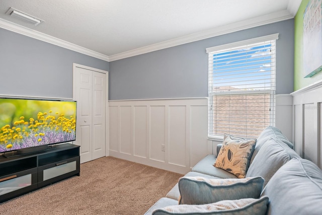 5401 Match Point Pl, Lithia, FL 33547 - carpeted living room with crown molding, wainscoting, and a decorative wall