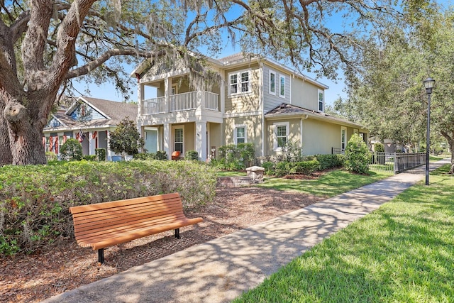 5401 Match Point Pl, Lithia, FL 33547 - view of front of home with stucco siding and a balcony