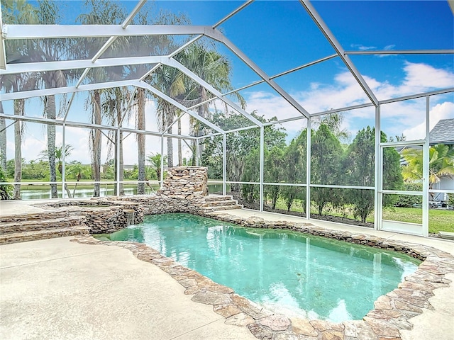 1443 Obear Ct, Wesley Chapel, FL 33543 - view of pool with glass enclosure, a patio area, and a pool with connected hot tub
