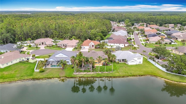 1443 Obear Ct, Wesley Chapel, FL 33543 - aerial view of property's location with a forest, nearby suburban area, and a nearby body of water