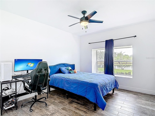 1443 Obear Ct, Wesley Chapel, FL 33543 - bedroom with wood finished floors, an office area, a ceiling fan, and baseboards