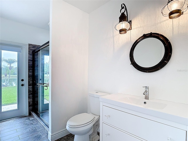 1443 Obear Ct, Wesley Chapel, FL 33543 - full bathroom with vanity, wood finished floors, toilet, and an enclosed shower