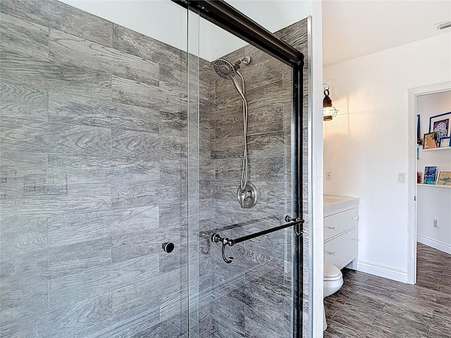 1443 Obear Ct, Wesley Chapel, FL 33543 - full bathroom with a stall shower, toilet, vanity, and baseboards