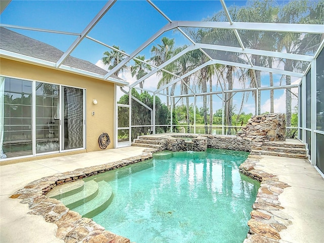 1443 Obear Ct, Wesley Chapel, FL 33543 - view of swimming pool featuring a patio, a pool with connected hot tub, and glass enclosure