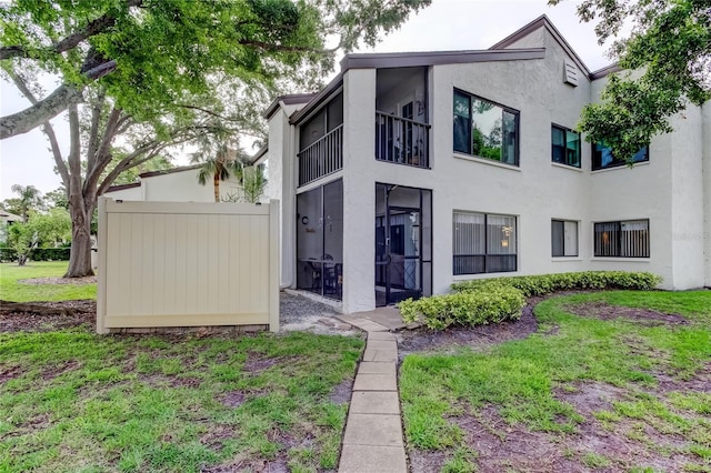700 Starkey Rd Unit 1216, Largo, FL 33771 - rear view of house featuring stucco siding and a balcony