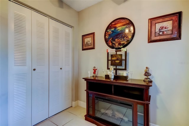 700 Starkey Rd Unit 1216, Largo, FL 33771 - hall featuring light tile patterned flooring and baseboards