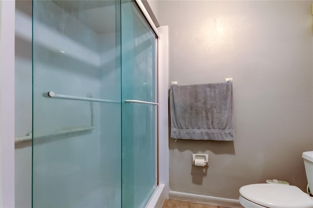 700 Starkey Rd Unit 1216, Largo, FL 33771 - full bathroom with toilet, a stall shower, and baseboards