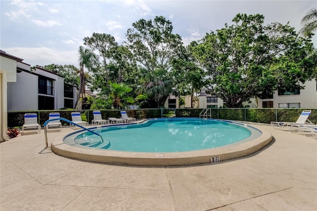 700 Starkey Rd Unit 1216, Largo, FL 33771 - community pool featuring a patio