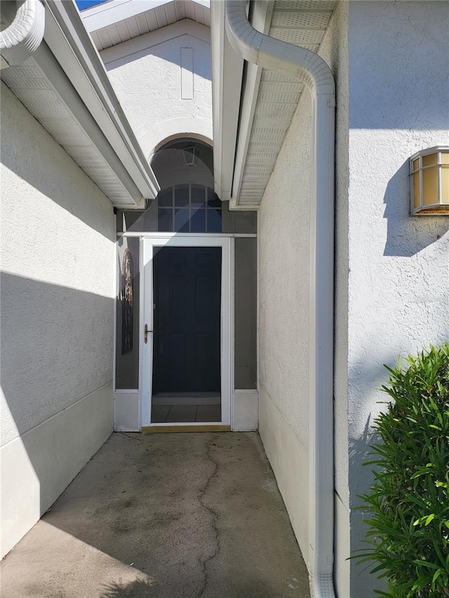 2325 Brookfield Greens Cir Unit 41, Sun City Center, FL 33573 - view of exterior entry with stucco siding