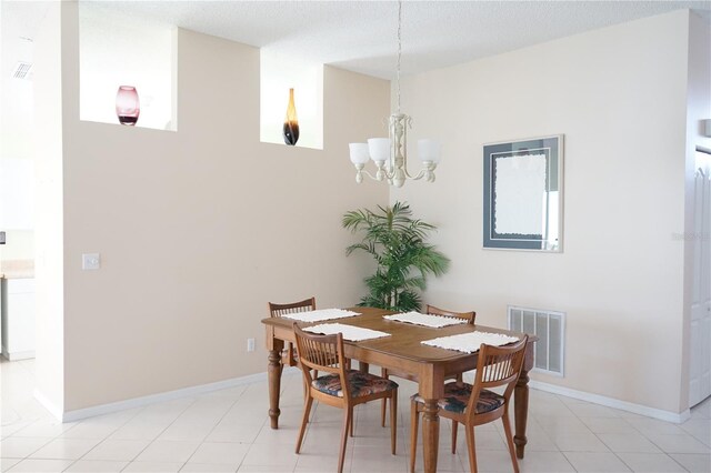 2325 Brookfield Greens Cir Unit 41, Sun City Center, FL 33573 - dining room with a chandelier and baseboards