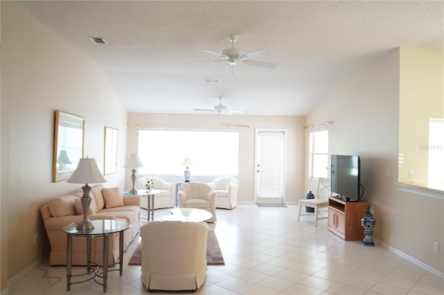 2325 Brookfield Greens Cir Unit 41, Sun City Center, FL 33573 - living room with lofted ceiling, ceiling fan, baseboards, and light tile patterned floors
