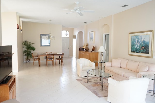 2325 Brookfield Greens Cir Unit 41, Sun City Center, FL 33573 - living area featuring arched walkways, ceiling fan, and light tile patterned flooring